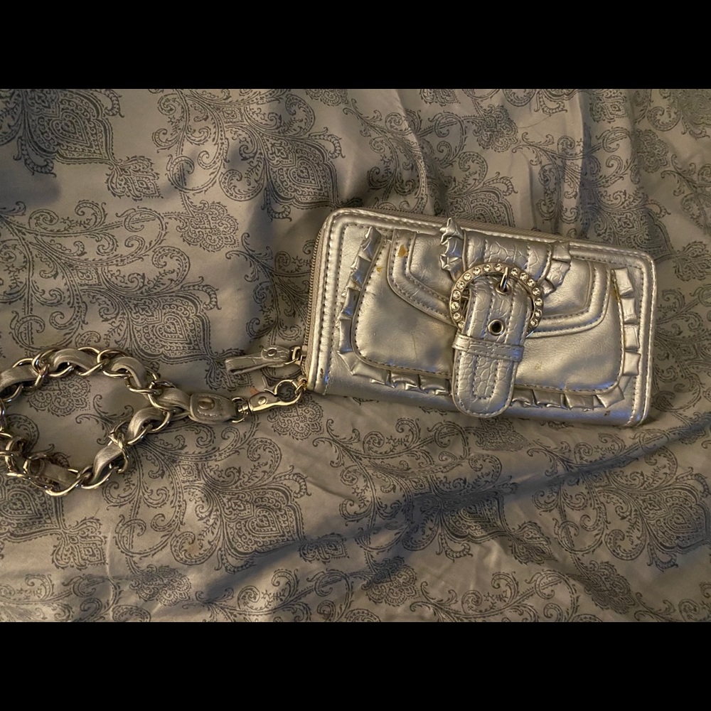 Silver wristlet, used but still has life.